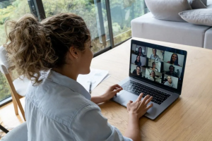 A girl on a video call promoting 5 ways to improve communication during remote work.